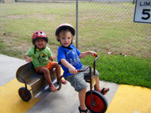 Preschool children on tricycles